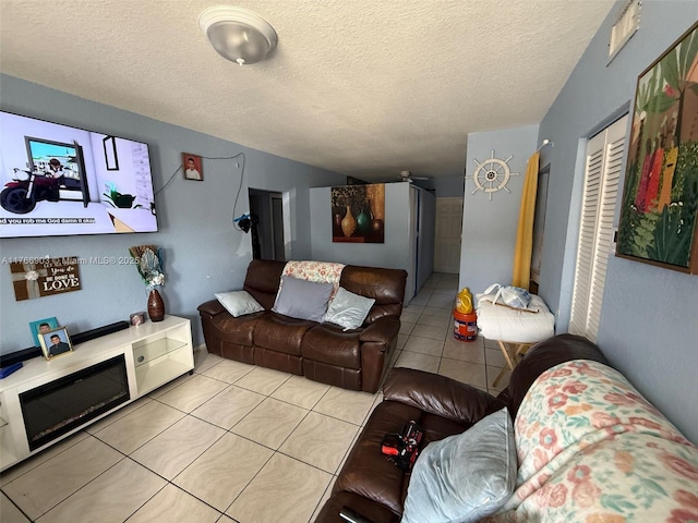 417 NW 84th St Unit 417, Miami, FL 33150 - living room featuring tile patterned floors and a textured ceiling