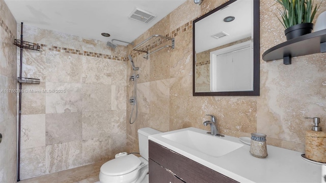 7601 E Treasure Dr Unit 1518, North Bay Village, FL 33141 - full bathroom with tile walls, tiled shower, vanity, and toilet