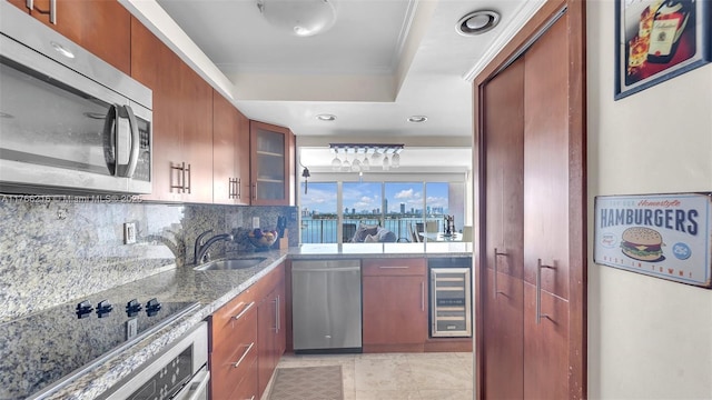 7601 E Treasure Dr Unit 1518, North Bay Village, FL 33141 - kitchen featuring stainless steel appliances, beverage cooler, a raised ceiling, a sink, and backsplash