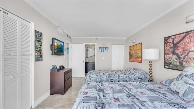 bedroom featuring crown molding, baseboards, visible vents, and ensuite bathroom