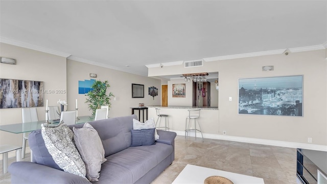 living area featuring visible vents, baseboards, and ornamental molding