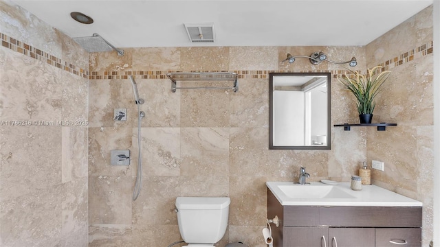 7601 E Treasure Dr Unit 1518, North Bay Village, FL 33141 - full bath with vanity, tile walls, a tile shower, and toilet