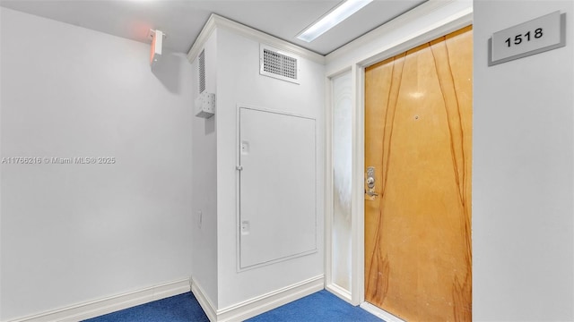 interior space with visible vents, baseboards, and carpet floors