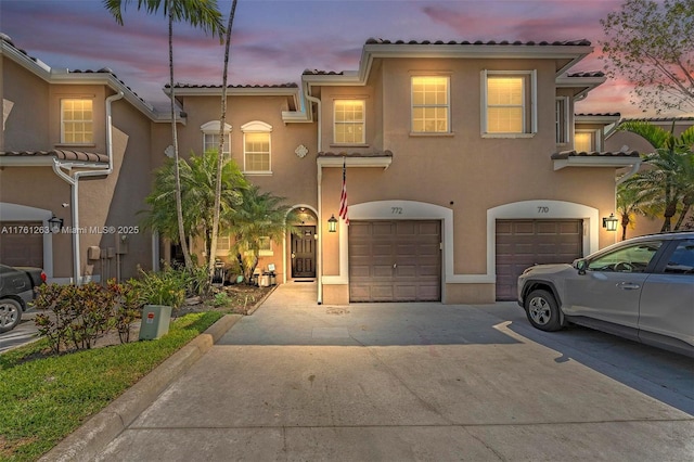 772 NW 132nd Ave, Plantation, FL 33325 - mediterranean / spanish-style home with a tiled roof, a garage, driveway, and stucco siding