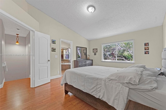 772 NW 132nd Ave, Plantation, FL 33325 - bedroom featuring baseboards, a textured ceiling, light wood-type flooring, and lofted ceiling