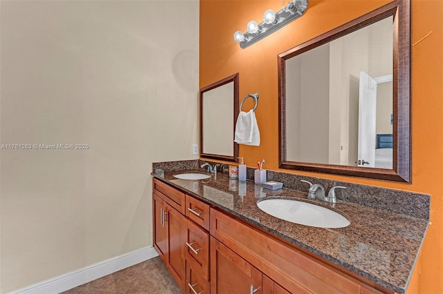 772 NW 132nd Ave, Plantation, FL 33325 - bathroom with tile patterned flooring, double vanity, baseboards, and a sink