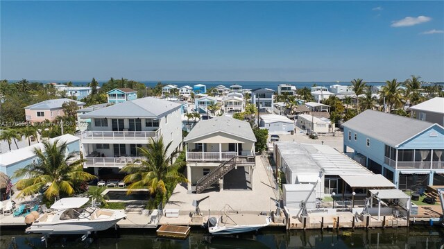 aerial view with a residential view and a water view