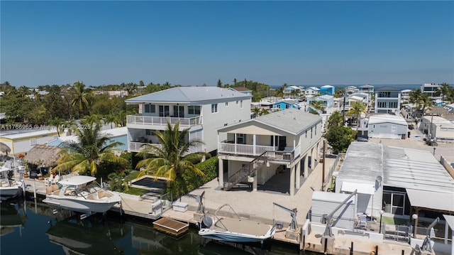 exterior space featuring a water view and a residential view