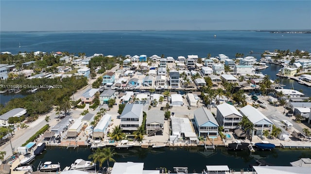 aerial view with a residential view and a water view