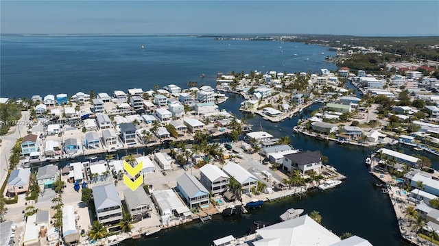 birds eye view of property with a residential view and a water view