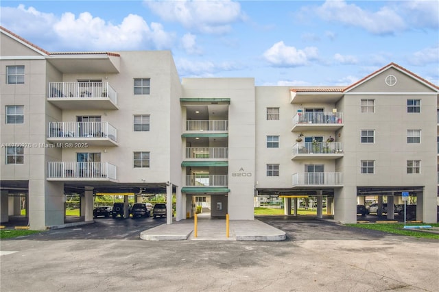 8200 SW 210th St Unit 111, Cutler Bay, FL 33189 - view of building exterior with covered parking