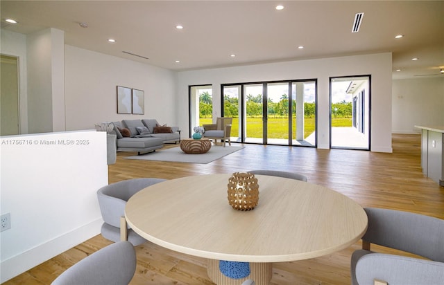 dining room featuring recessed lighting, light wood-style flooring, baseboards, and visible vents