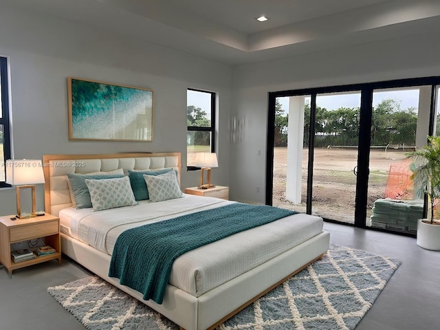 bedroom featuring access to exterior and recessed lighting