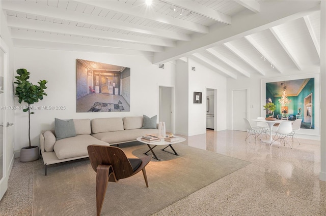 1040 NE 85th St, Miami, FL 33138 - living room featuring beamed ceiling and baseboards