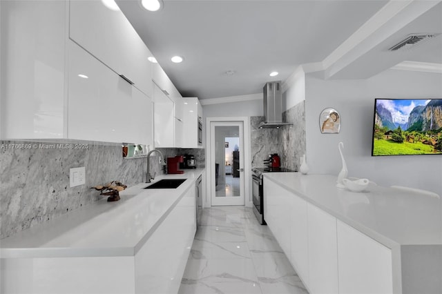 kitchen with visible vents, range with electric cooktop, modern cabinets, and wall chimney range hood