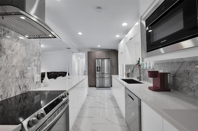 kitchen with a sink, stainless steel appliances, marble finish floor, white cabinetry, and modern cabinets