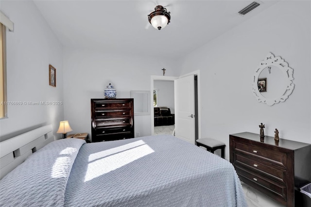 bedroom with visible vents and marble finish floor