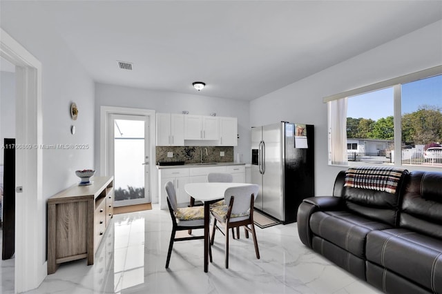 interior space with visible vents and marble finish floor