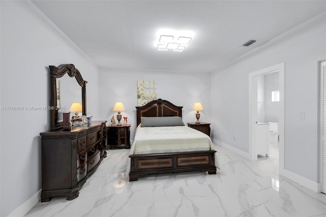 bedroom featuring connected bathroom, visible vents, marble finish floor, and baseboards