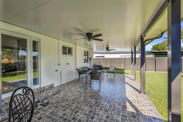 view of patio / terrace with fence and ceiling fan
