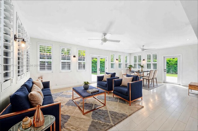 living room featuring baseboards, ceiling fan, french doors, and recessed lighting