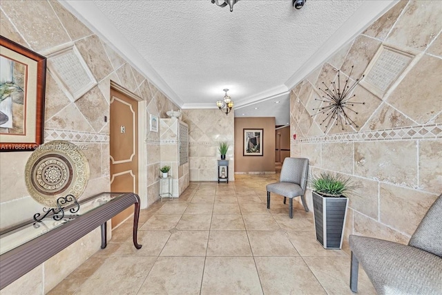 corridor featuring tile walls, a notable chandelier, tile patterned floors, and a textured ceiling