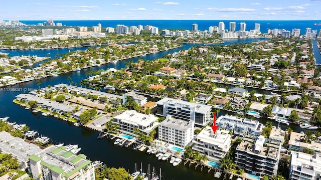 drone / aerial view featuring a water view and a city view