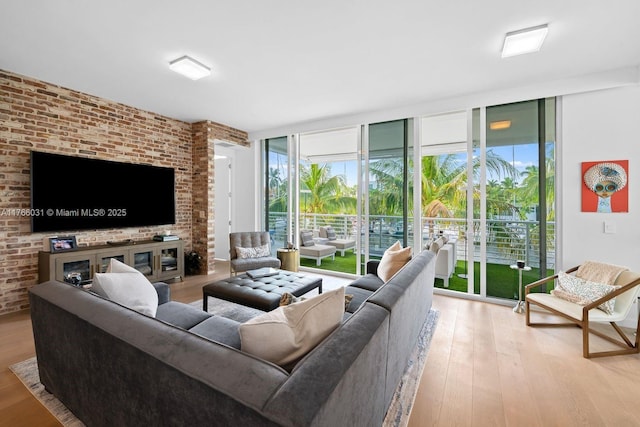 living room with floor to ceiling windows and wood finished floors