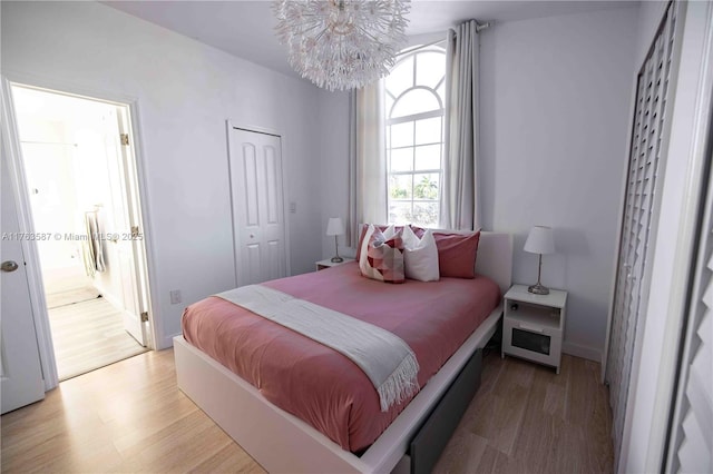 14016 SW 160th St, Miami, FL 33177 - bedroom with a chandelier, a closet, and light wood-style floors