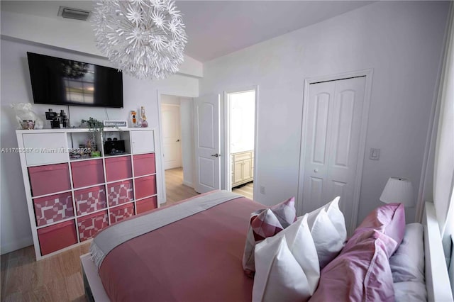 14016 SW 160th St, Miami, FL 33177 - bedroom featuring a closet, visible vents, ensuite bath, and light wood-type flooring