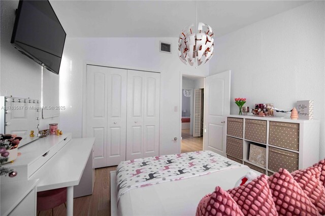 14016 SW 160th St, Miami, FL 33177 - bedroom featuring vaulted ceiling, wood finished floors, visible vents, and a closet