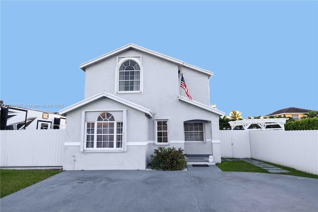 14016 SW 160th St, Miami, FL 33177 - rear view of house with fence, a pergola, and stucco siding