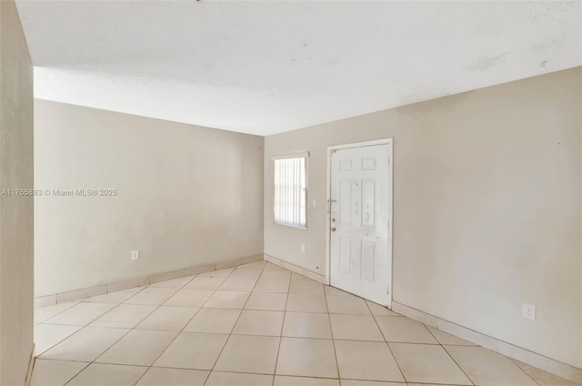 spare room featuring tile patterned flooring