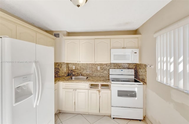 kitchen with decorative backsplash, visible vents, white appliances, a sink, and light tile patterned floors