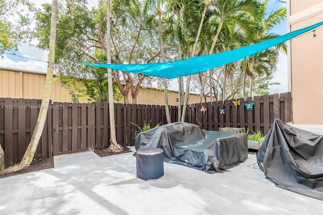 view of patio featuring area for grilling and a fenced backyard
