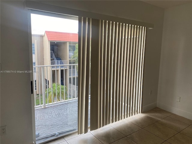 5102 NW 79th Ave Unit 304, Doral, FL 33166 - unfurnished room featuring tile patterned floors, plenty of natural light, and baseboards