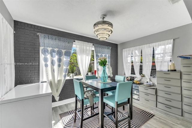 2813 SW 67th Ln, Miramar, FL 33023 - dining area featuring an inviting chandelier and light wood finished floors
