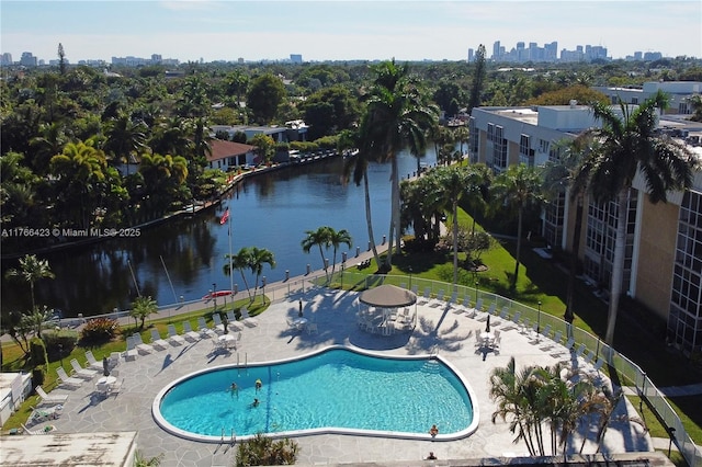 3040 NE 16th Ave Unit 104, Oakland Park, FL 33334 - community pool featuring a skyline view, a water view, and a patio