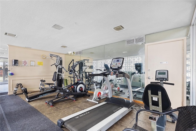 3040 NE 16th Ave Unit 104, Oakland Park, FL 33334 - workout area with a textured ceiling