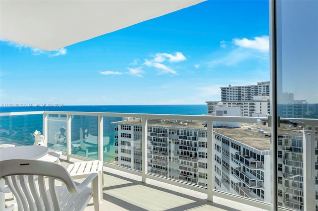 balcony featuring a view of city and a water view