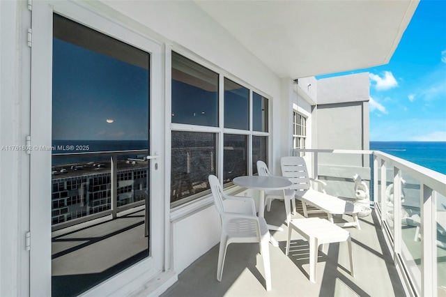 balcony featuring a water view