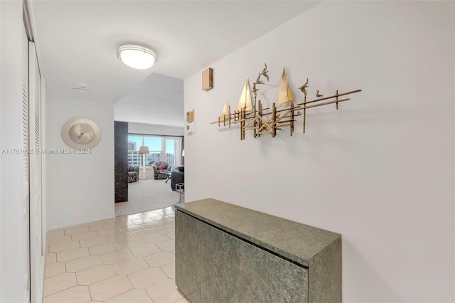 hallway with light tile patterned floors