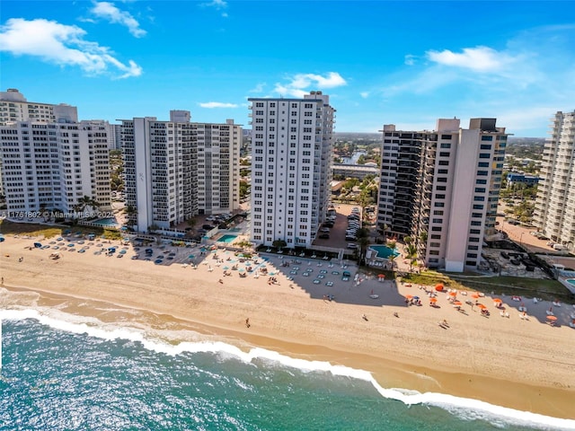 aerial view featuring a view of the beach, a view of city, and a water view