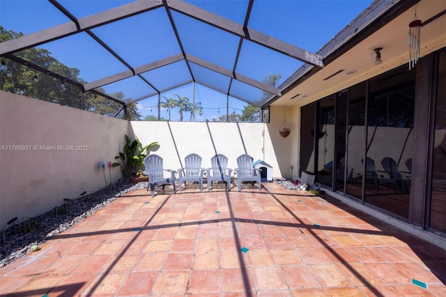 view of patio / terrace with glass enclosure