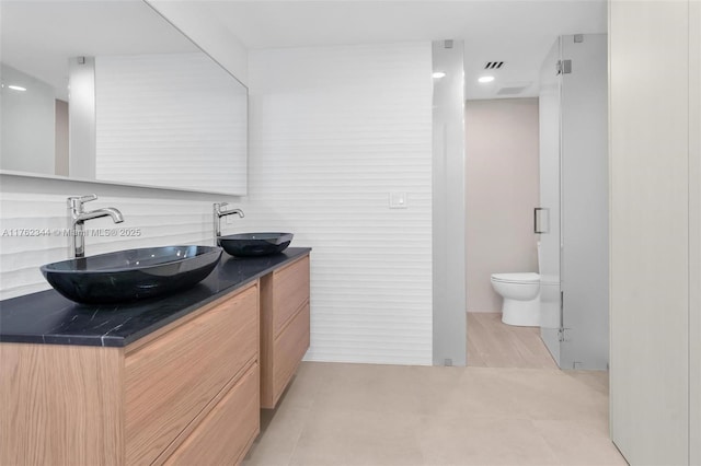 5255 Collins Ave Unit 9B, Miami Beach, FL 33140 - full bathroom featuring double vanity and toilet