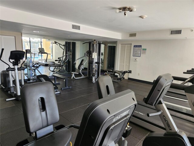 4242 NW 2nd St Unit 1202, Miami, FL 33126 - exercise room featuring visible vents and baseboards