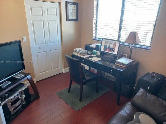 4242 NW 2nd St Unit 1202, Miami, FL 33126 - home office featuring wood finished floors, baseboards, and a healthy amount of sunlight