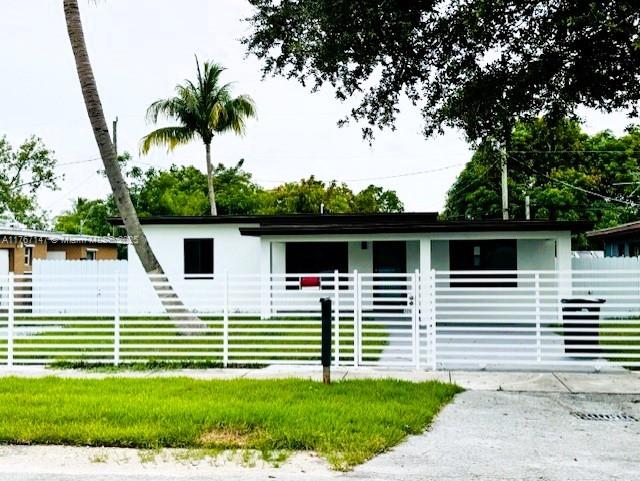11730 NW 3rd Ave, Miami, FL 33168 - view of front facade featuring fence