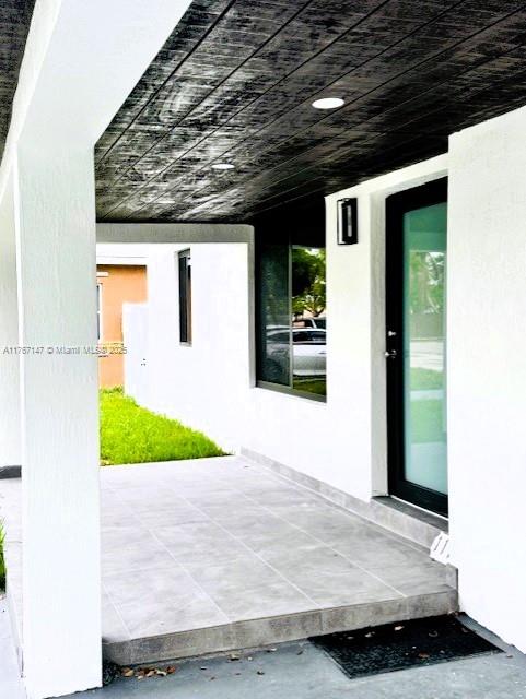 11730 NW 3rd Ave, Miami, FL 33168 - view of exterior entry with stucco siding