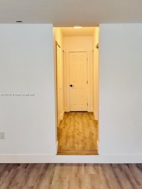 11730 NW 3rd Ave, Miami, FL 33168 - corridor featuring wood finished floors and baseboards
